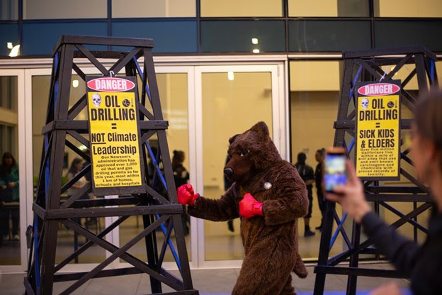 A protest against Big Oil outside the state Democratic Party convention at the SAFE Credit Union Convention Center in Sacramento on Nov. 17, 2023.