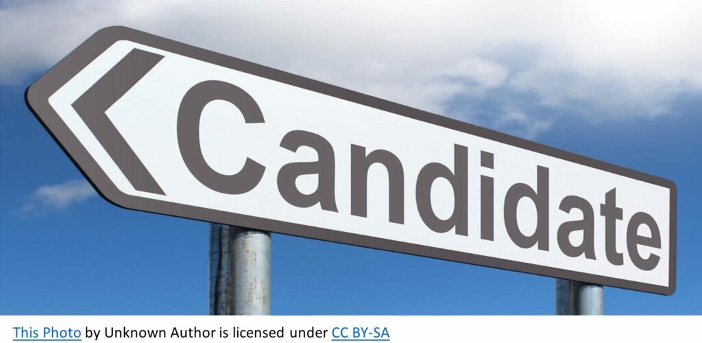 A large sign that says "candidate" with an arrow